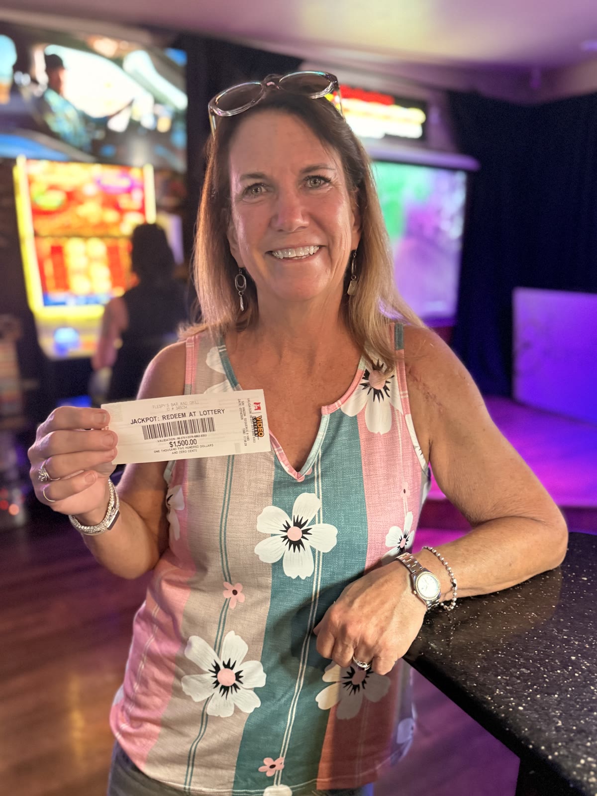 Guest celebrating an Oregon Video Lottery jackpot at Flespy’s